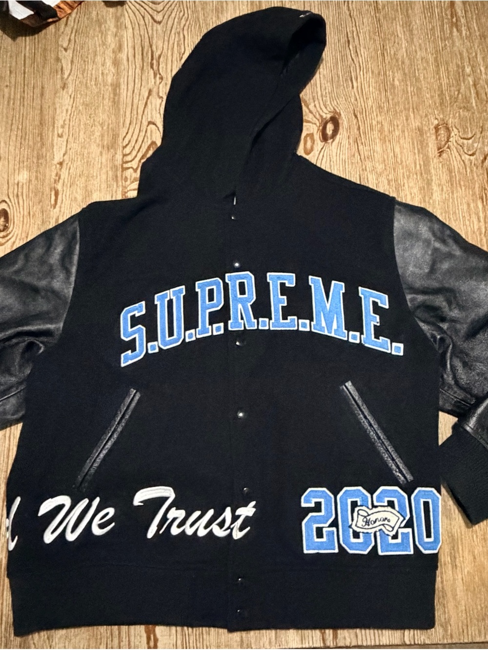 Supreme Black Hooded Varsity Jacket with Blue Lettering